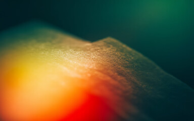 Abstract textured surface with warm and cool color gradients