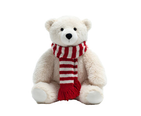 A soft polar bear plush toy with a festive red and white striped scarf.