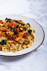rice dish with dried fruits, nuts and spices of Middle Eastern cuisine, homemade, no people,