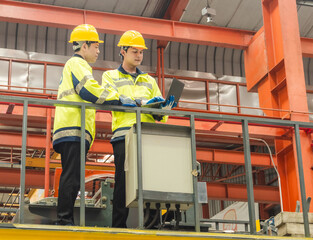 Leader manager talk work order staff engineer technician team in hard hat and uniform safety vest...