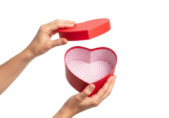 Photo of hands opening a heart shaped gift box to reveal the interior against a transparent background to celebrate a special occasion