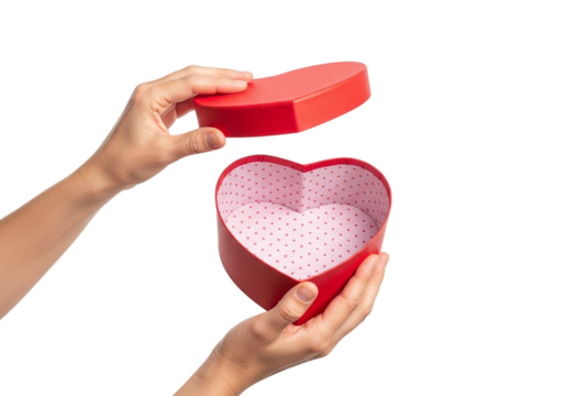 Photo of hands opening a heart shaped gift box to reveal the interior against a transparent background to celebrate a special occasion