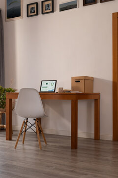 Workspace Setup With a Laptop and Minimal Decor in a Home Office