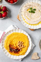 Healthy white bean and pumpkin hummus for snacking. Different types of hummus. Vegetarian snack