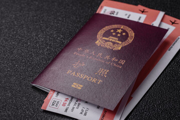 China, Chinese passport with money and flight tickets. Chinese passport with tickets