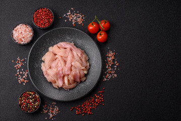 Raw chicken meat cut into strips, fresh fillet or breast slices. Chicken raw meat in pieces