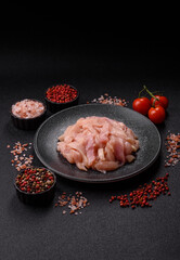 Raw chicken meat cut into strips, fresh fillet or breast slices. Chicken raw meat in pieces