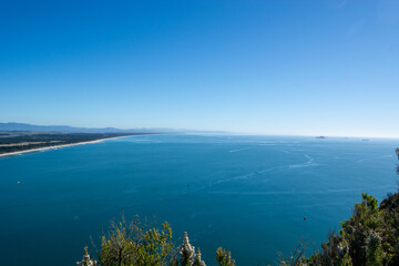 Panoramic Ocean View Under Clear Blue Sky