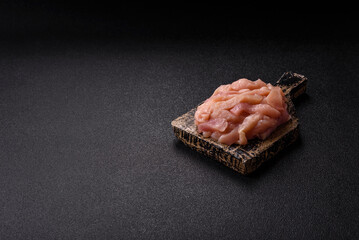 Raw chicken meat cut into strips, fresh fillet or breast slices. Chicken raw meat in pieces