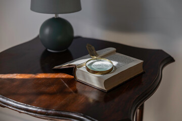 Magnifying glass on an open book