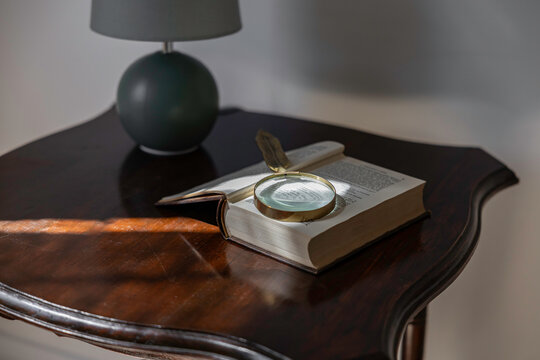 Magnifying glass on an open book