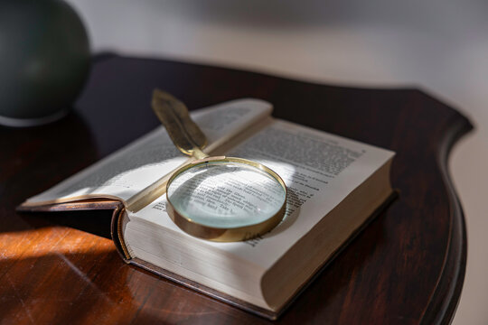 Magnifying glass on a book page
