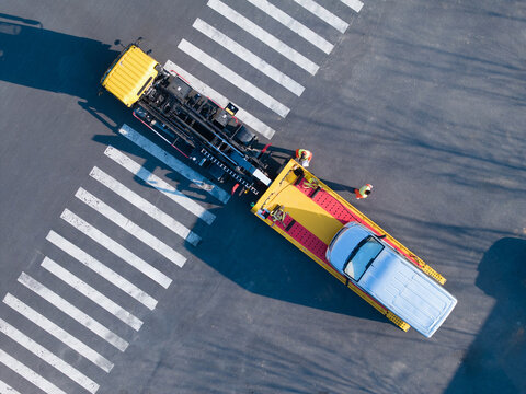 Vertical Aerial View of Tow Truck and Car