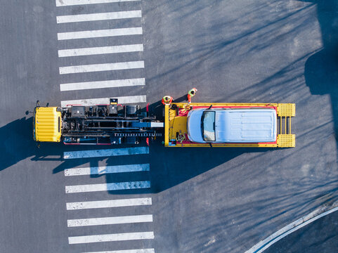 Vertical Aerial View of Tow Truck and Car
