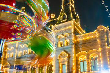 Spinning Carousel and Festive Building Lights