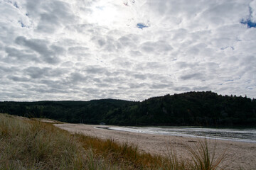 Serene Beach Landscape Under Cloudy Sky