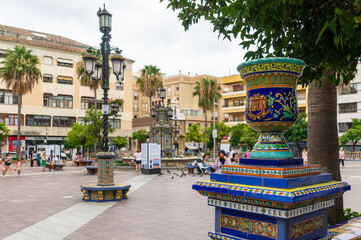 Plaza Alta de Algeciras, focusing on a decorative element with the fountain and background blurred.
