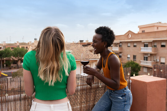 Women having fun together outdoor on rooftop