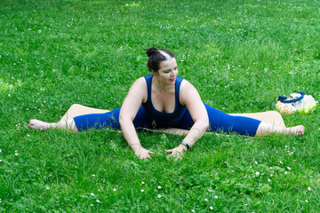 Woman and sports, exercise for weight loss in the fresh air. Happy curvy 40s woman doing workout...