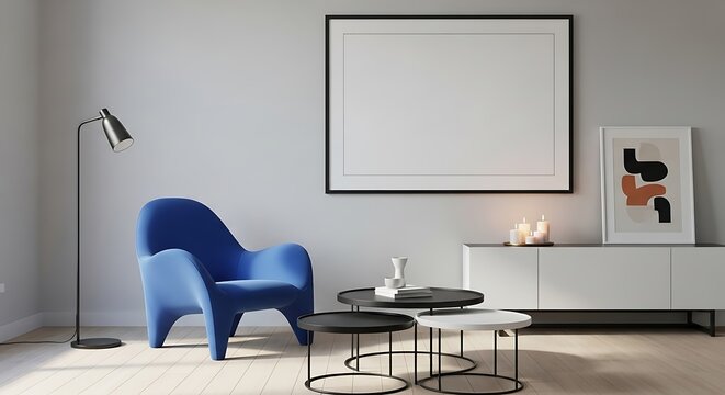Modern living room interior with blue armchair, coffee tables, and blank wall for art