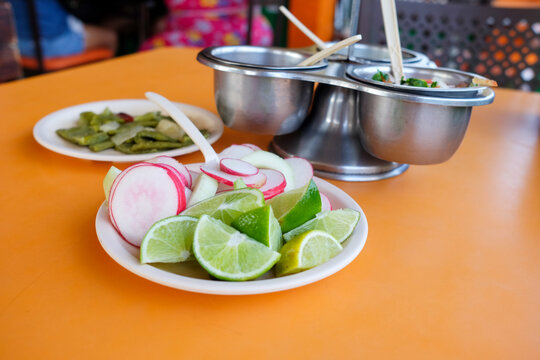 Traditional Mexican Condiments on Orange Table