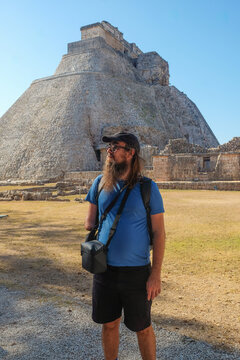  Visitor Observing Uxmal Ruins