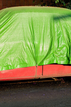 Car Covered with Green Tarp
