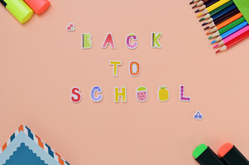 back to school sign and school supplies around flat lay