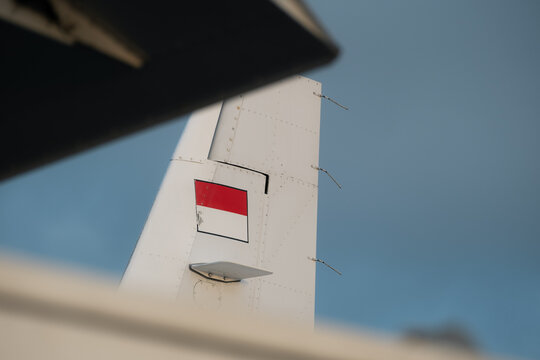 Close-up of aircraft tail with Indonesian flag marking