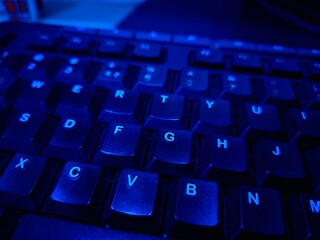 Close-up of a modern computer keyboard with sleek keys, ideal for illustrating digital workspaces, tech setups, and productivity themes. Perfect for business, IT, and e-learning visuals.