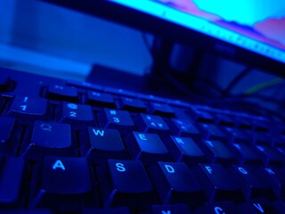 Close-up of a modern computer keyboard with sleek keys, ideal for illustrating digital workspaces,...