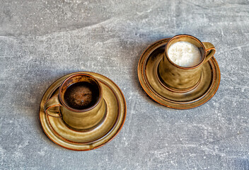 Coffee and whey in cups on the table