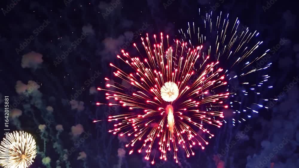 Poster colorful fireworks exploding across dark sky, bursting with brilliant hues during nighttime festive 