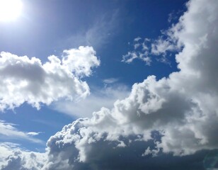 Obraz premium A bright blue sky with puffy white clouds