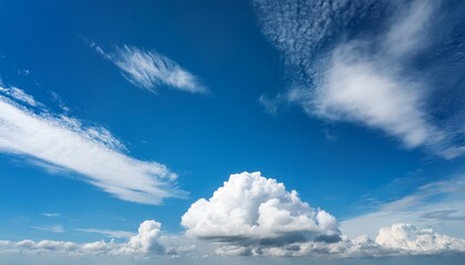soft billowy cumulus clouds create a serene atmosphere as they float in a vibrant blue sky this versatile cloud formation can enhance various creative projects with its natural beauty and airy feel