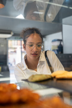 Woman deciding on snacks to buy for work