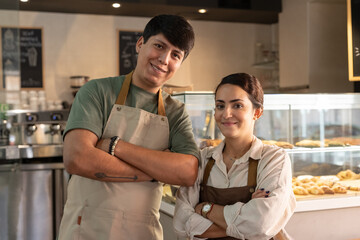 Bakery Owners Smiling Proudly in Their Shop 