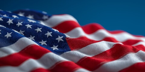 Close up of a waving American flag showcasing its red, white, and blue colors against a blue background, ideal for patriotic themes, ideal for advertising, marketing, website backgrounds, banners