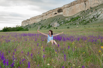 Obraz premium Photo session outdoors of a pretty girl in shorts, a shirt and a dress