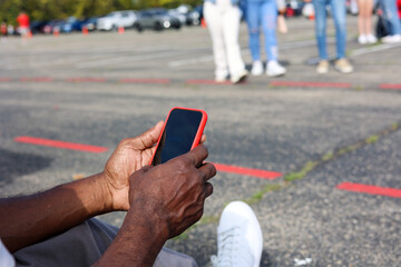 A black man calling for a ride share service