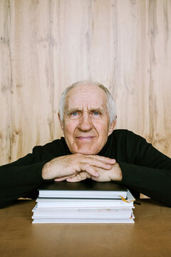 Portrait of a man with books