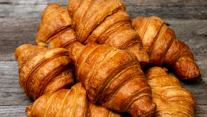 Freshly baked french croissant. Golden croissant for breakfast