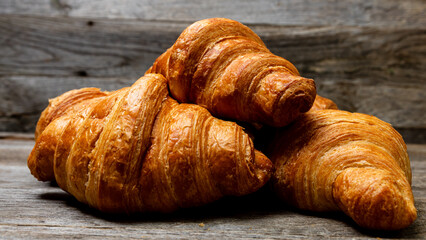 Freshly baked french croissant. Golden croissant for breakfast