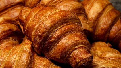Freshly baked french croissant. Golden croissant for breakfast