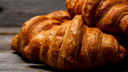 Freshly baked french croissant. Golden croissant for breakfast