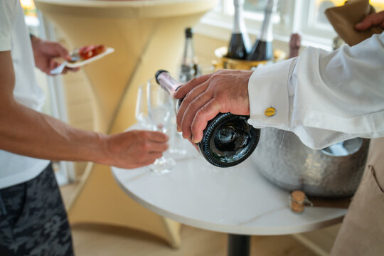 pouring wine - Powered by Adobe