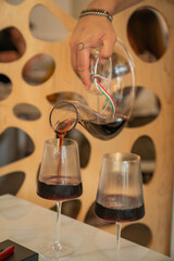 pouring glasses of wine