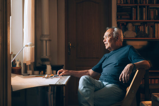 Retired architect/engineer at his home