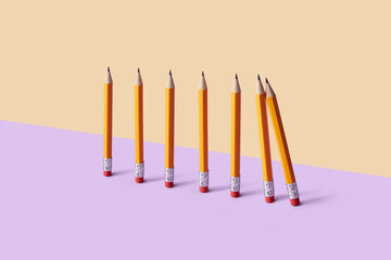 Standing pencils symbolizing support and risk