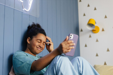 Confused girl dealing with bad internet connection on smartphone